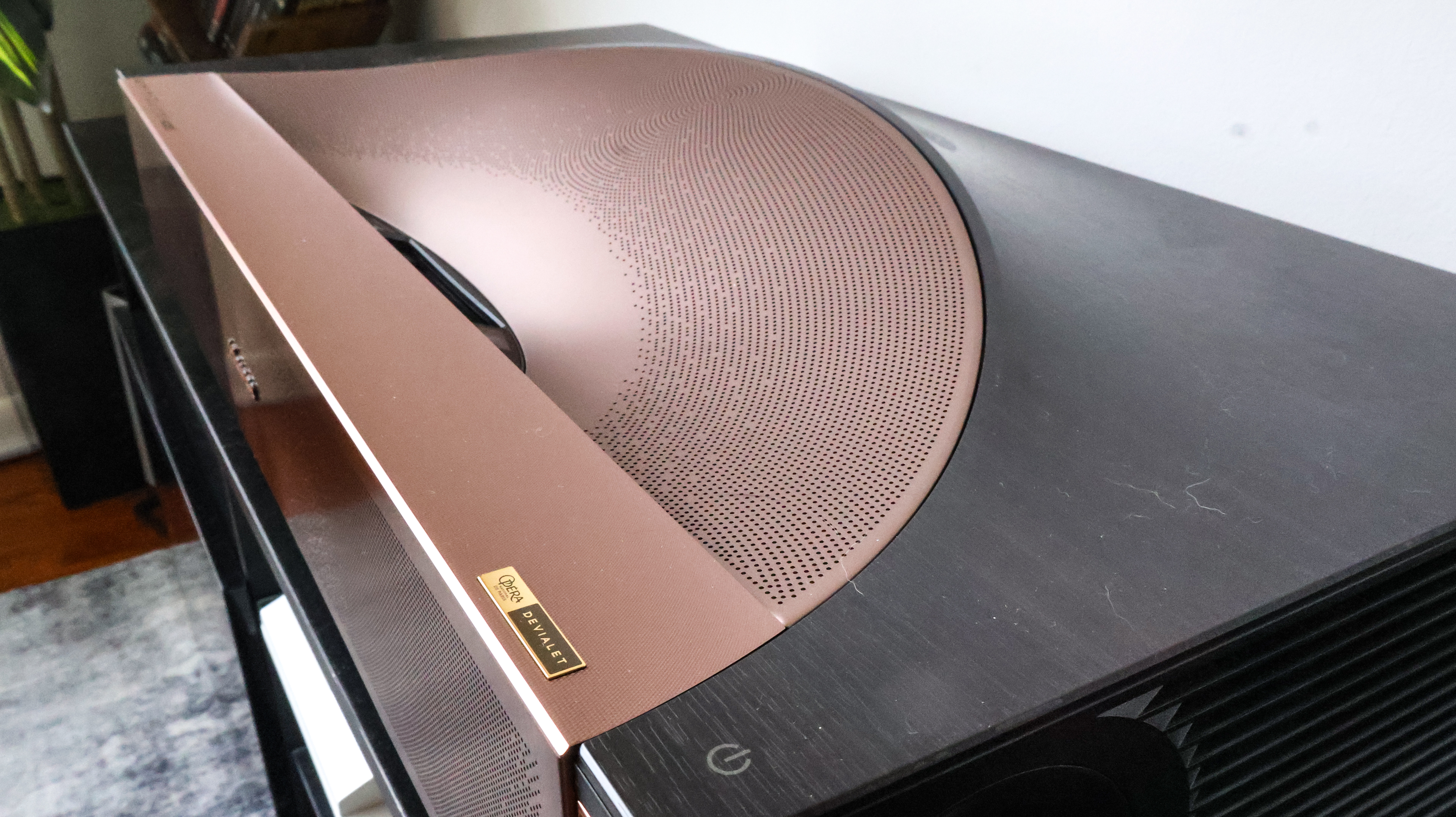 The Hisense L9Q UST projector in a living room