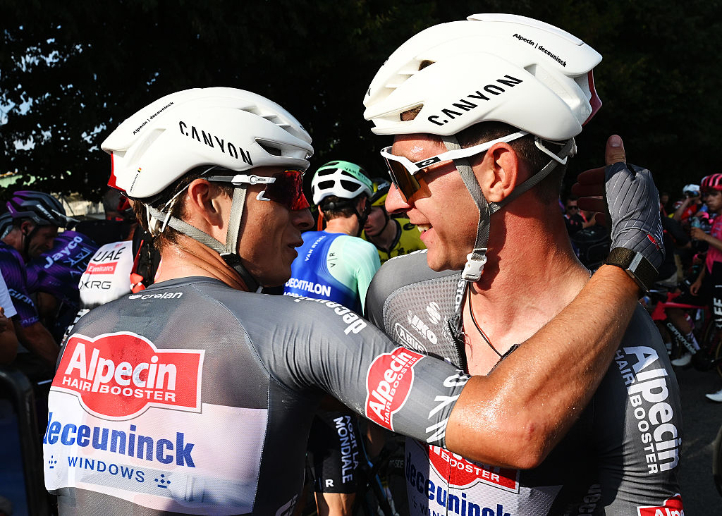 NOVARA, ITALY - AUGUST 23: (L-R) Stage winner Jasper Philipsen of Belgium and Ramses Debruyne of Belgium and Team Alpecin - Deceuninck react after the La Vuelta - 80th Tour of Spain 2025, Stage 1 a 186.7km stage from Torino-Reggia di Venaria to Novara / #UCIWT / on August 23, 2025 in Novara, Italy. (Photo by Dario Belingheri/Getty Images)
