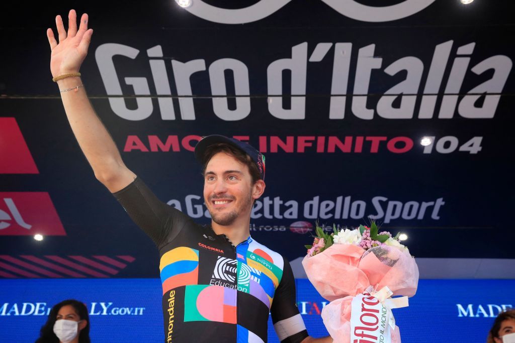 Team EF Education rider Italys Alberto Bettiol celebrates on the podium after winning the 18th stage of the Giro dItalia 2021 cycling race 231km between Rovereto and Stradella on May 27 2021 Photo by Luca BETTINI AFP Photo by LUCA BETTINIAFP via Getty Images