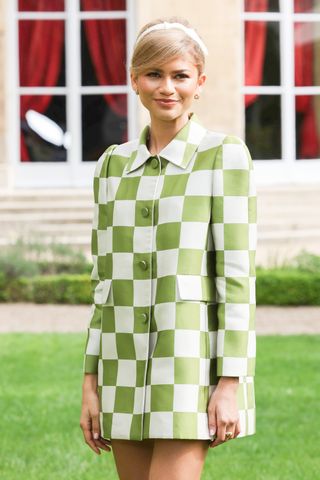 Zendaya wears a checkered Marc Jacobs for Louis Vuitton dress while doing press for Challengers