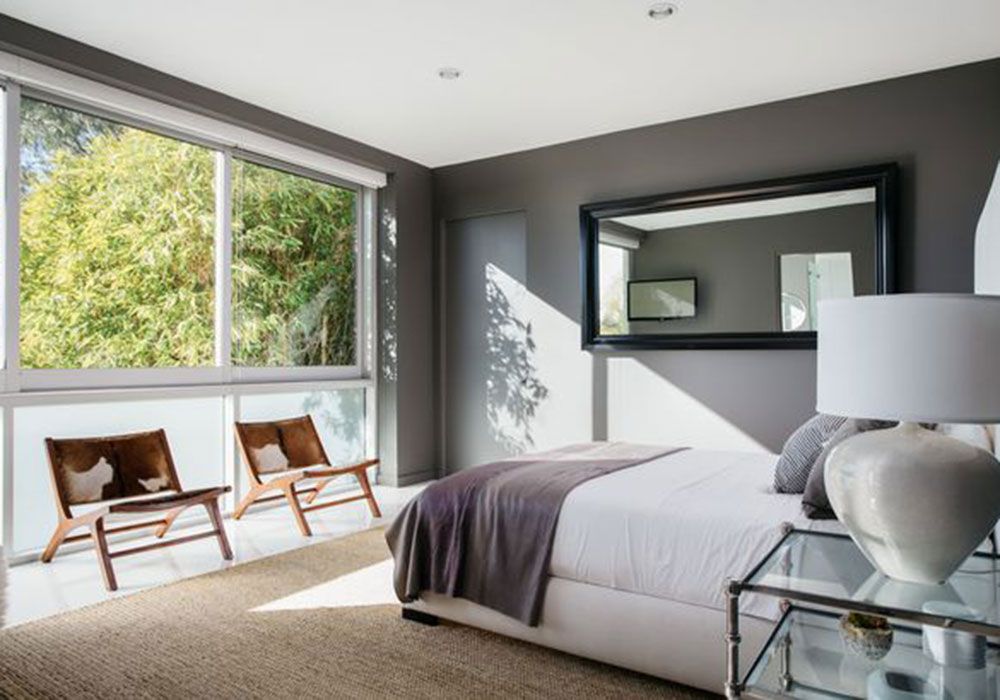 bedroom with glass winodw and grey wall