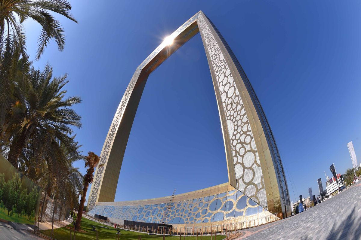 The size of the Dubai Frame makes the riders look like ants