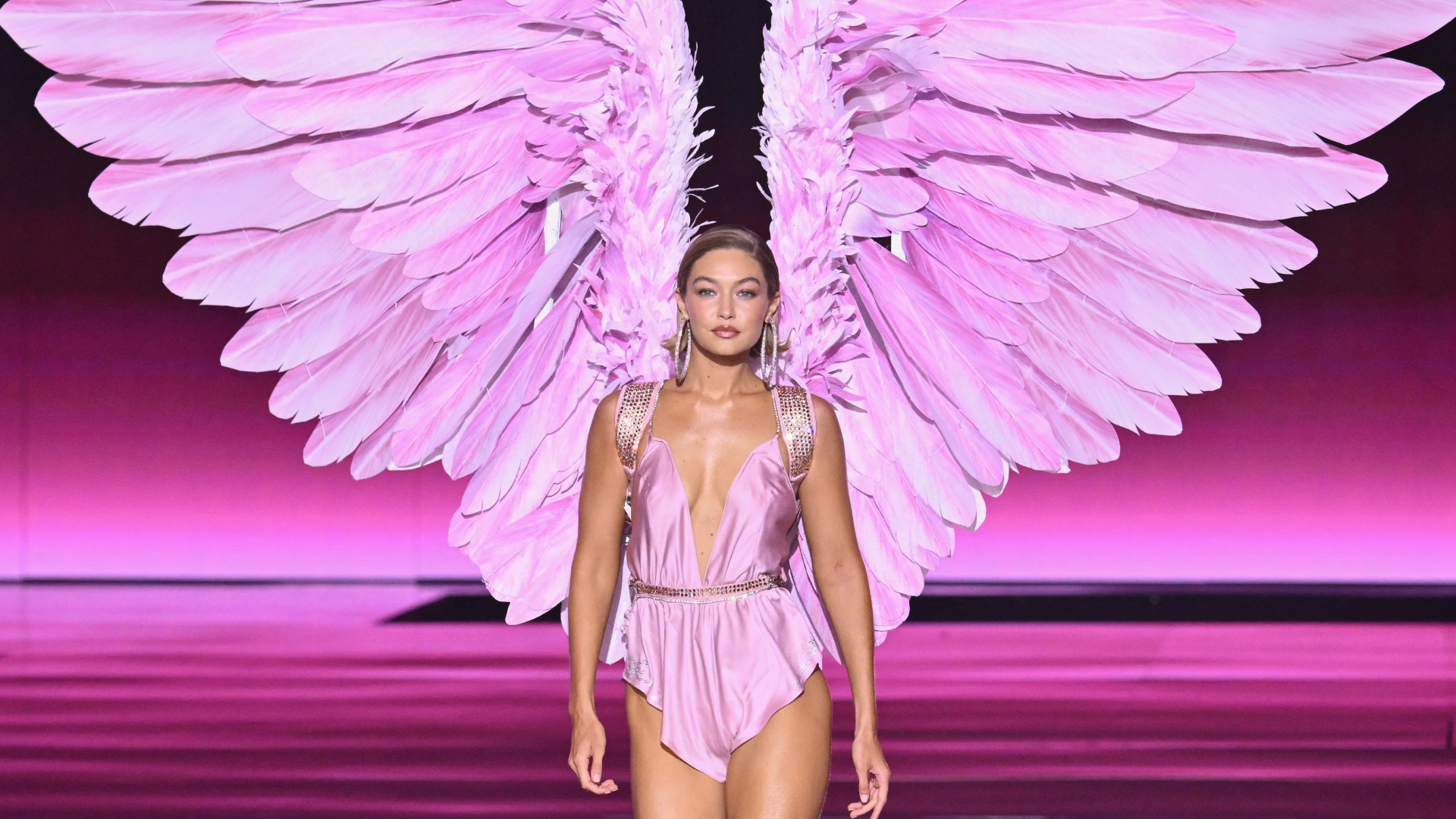 Gigi Hadid walks the 2024 Victoria's Secret Fashion Show runway with pink feathered wings