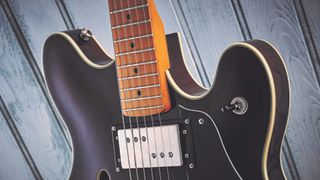 Closeup of the neck pickup and neck of Squier Classic Vibe Starcaster