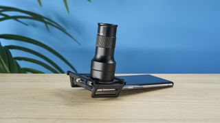 An Apexel TM6 TeleMacro lens for smartphones