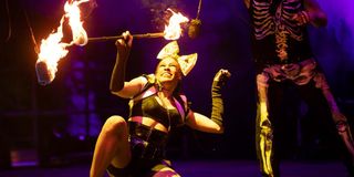 performer spinning fire baton at universal orlando's halloween horror nights