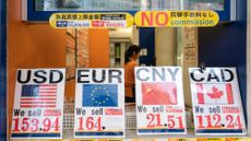 Exchange rates displayed outside a bureau de change in Tokyo