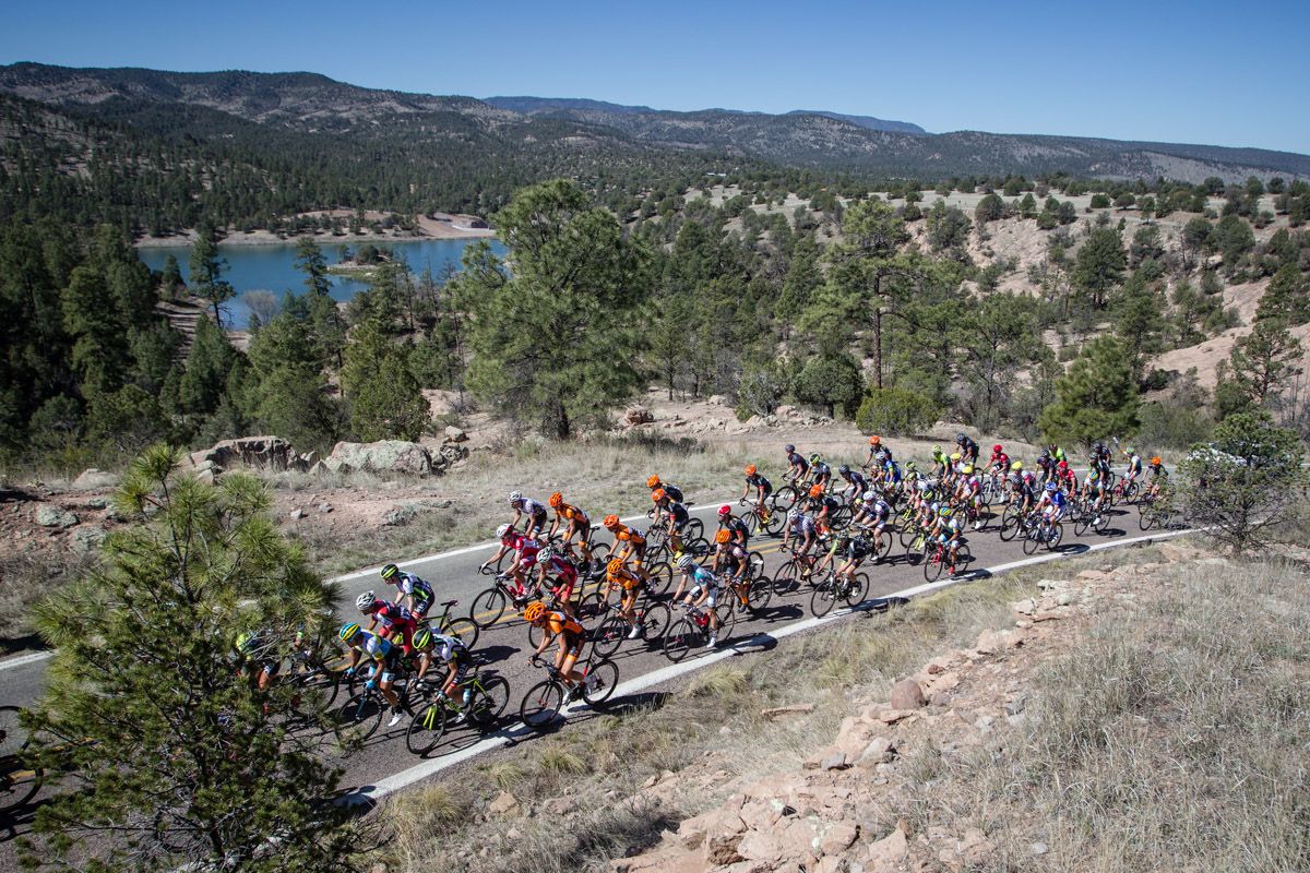 The men's peloton passes by Lake Roberts