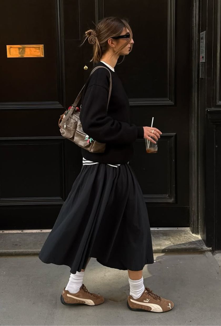 @poppyalmond wears a midi skirt
