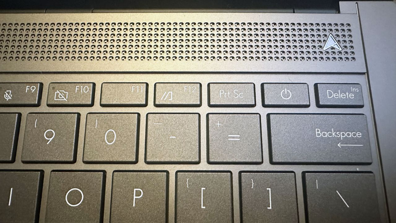 Close-up of the speakers and upper-right corner of the keyboard on the Asus Zenbook S 14.