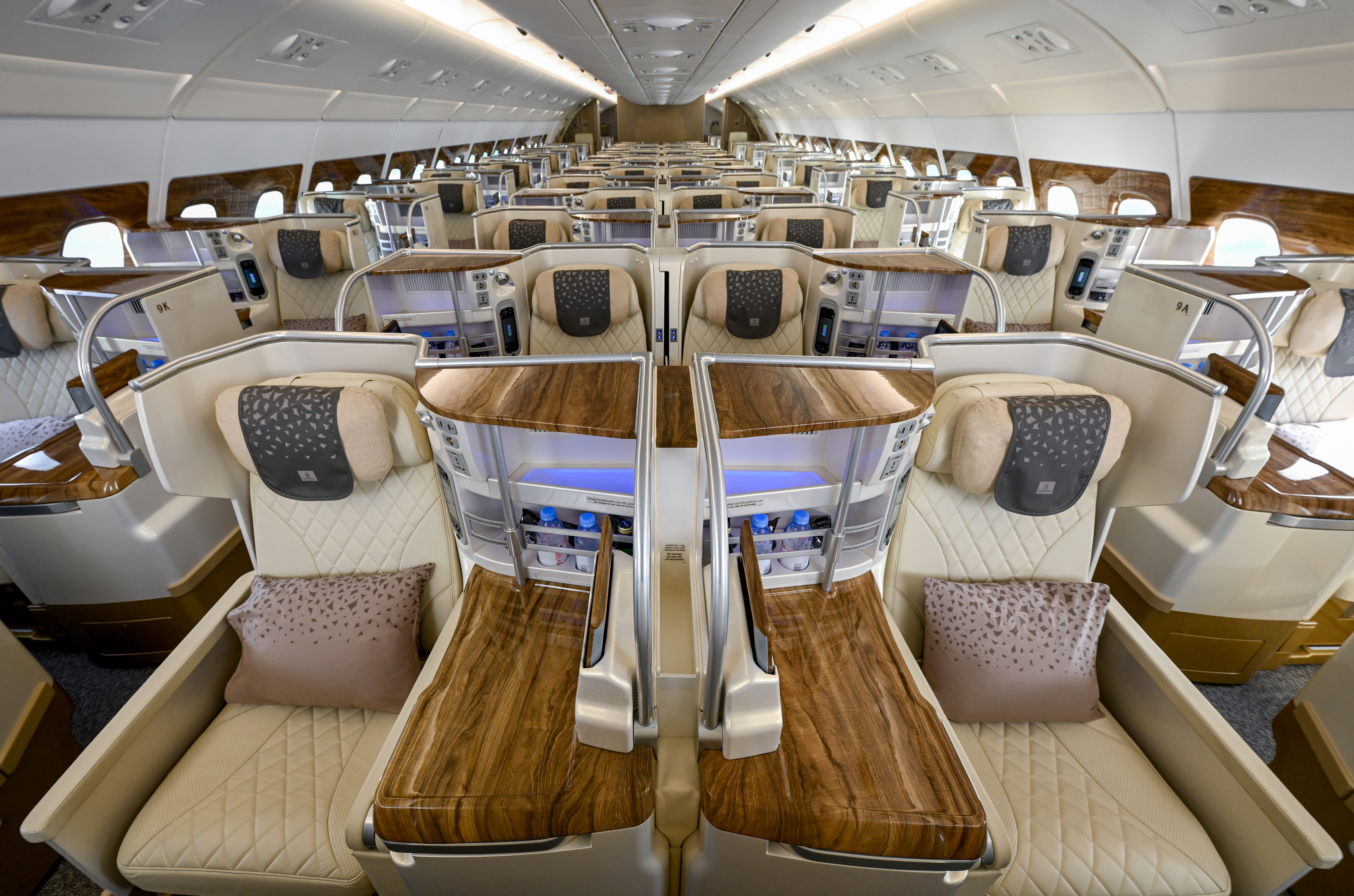 view of the interior of an aeroplane cabin featuring a beige design