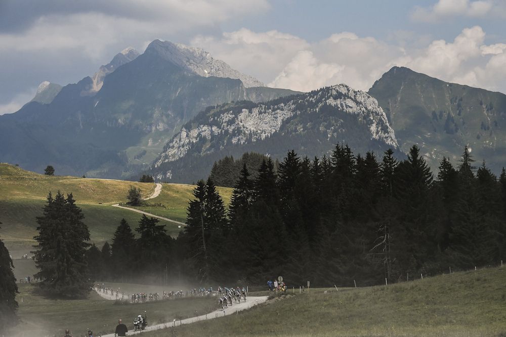 Mountains loom ominously over the gravel sector during stage 10 at the Tour de France