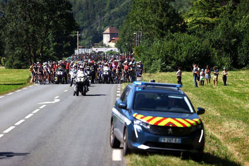 MEGEVE FRANCE JULY 12 A general view of the peloton stopped due to protesters in defending Mont Blanc environment blocking the route during the 109th Tour de France 2022 Stage 10 a 1481km stage from Morzine to Megve 1435m TDF2022 WorldTour on July 12 2022 in Megeve France Photo by Michael SteeleGetty Images