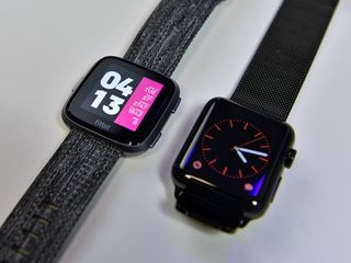 Fitbit Versa (left) is a third the weight of the Apple Watch v2 (right).