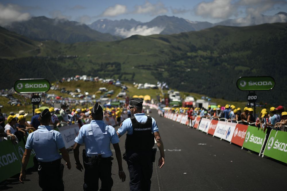 Gendarmes are on site to ensure everything goes smoothly as the race passes by.
