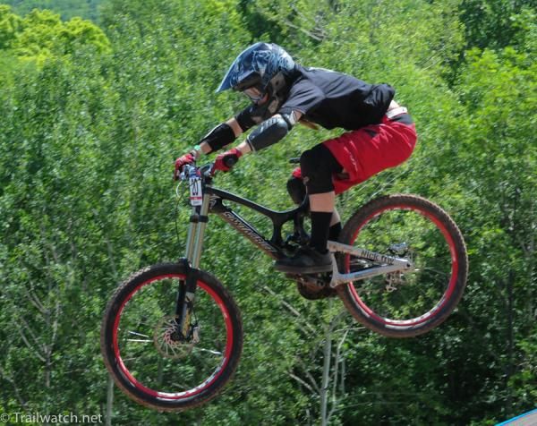 A rider flies off the final jump