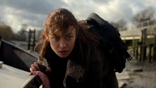 Kara Yerzov hides from some mercenaries in Netflix's Treason