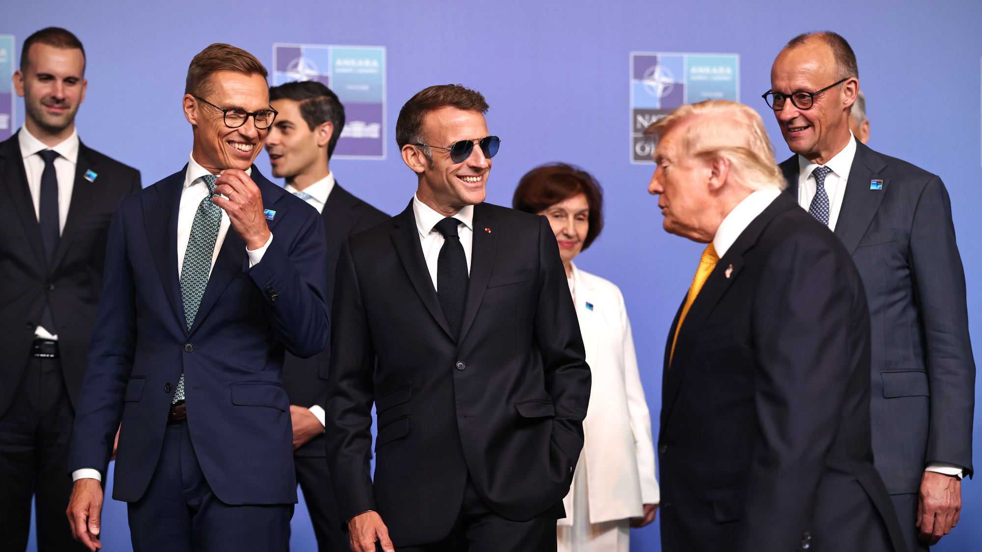 President Donald Trump  joins President of Finland, Alexander Stubb, French President, Emmanuel Macron and German Chancellor, Friedrich Merz ahead of a family photo during the NATO summit in Turkey
