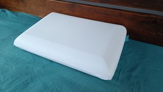 The Levitex Sleep Posture Pillow pictured on our tester's bed.