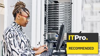 woman working on a server control machine in a server room