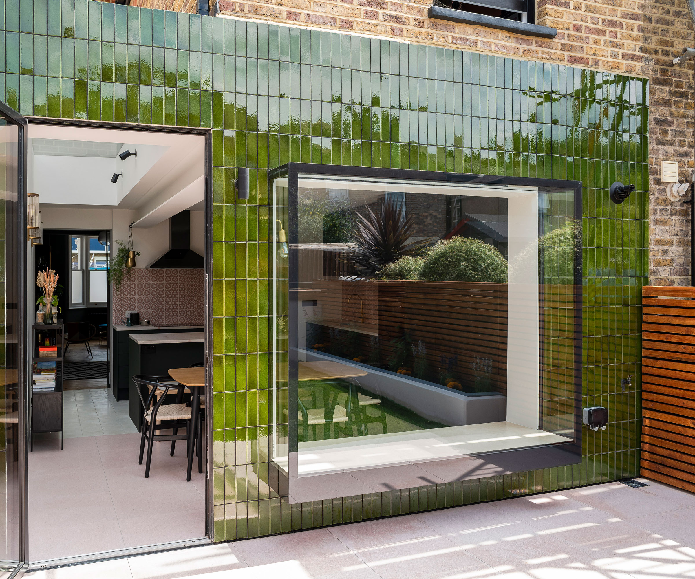 green tiled single storey kitchen extension on terraced house