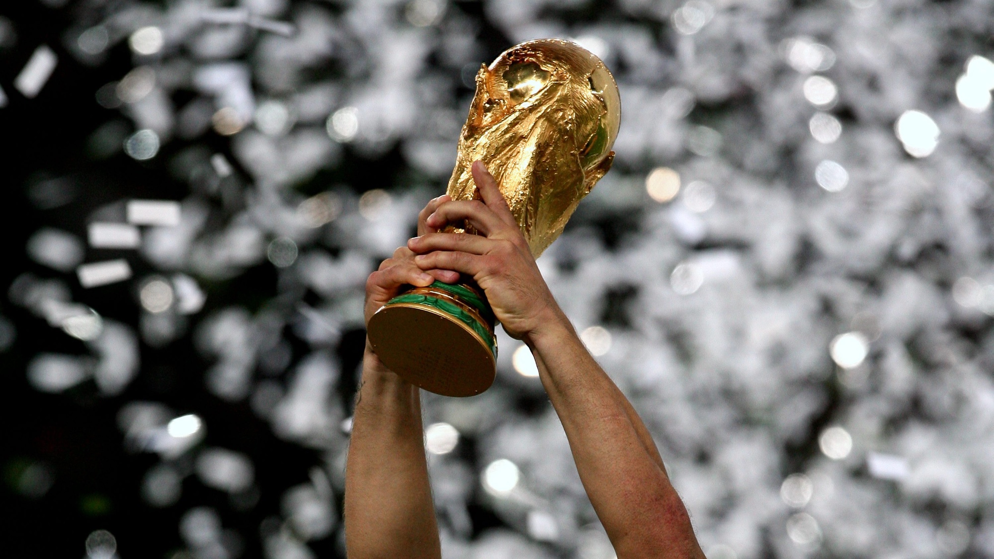 World Cup trophy being held aloft