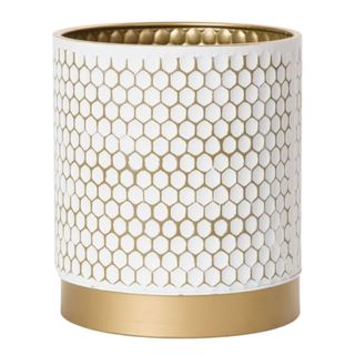 Gold and white honeycomb trash can with gold base and interior