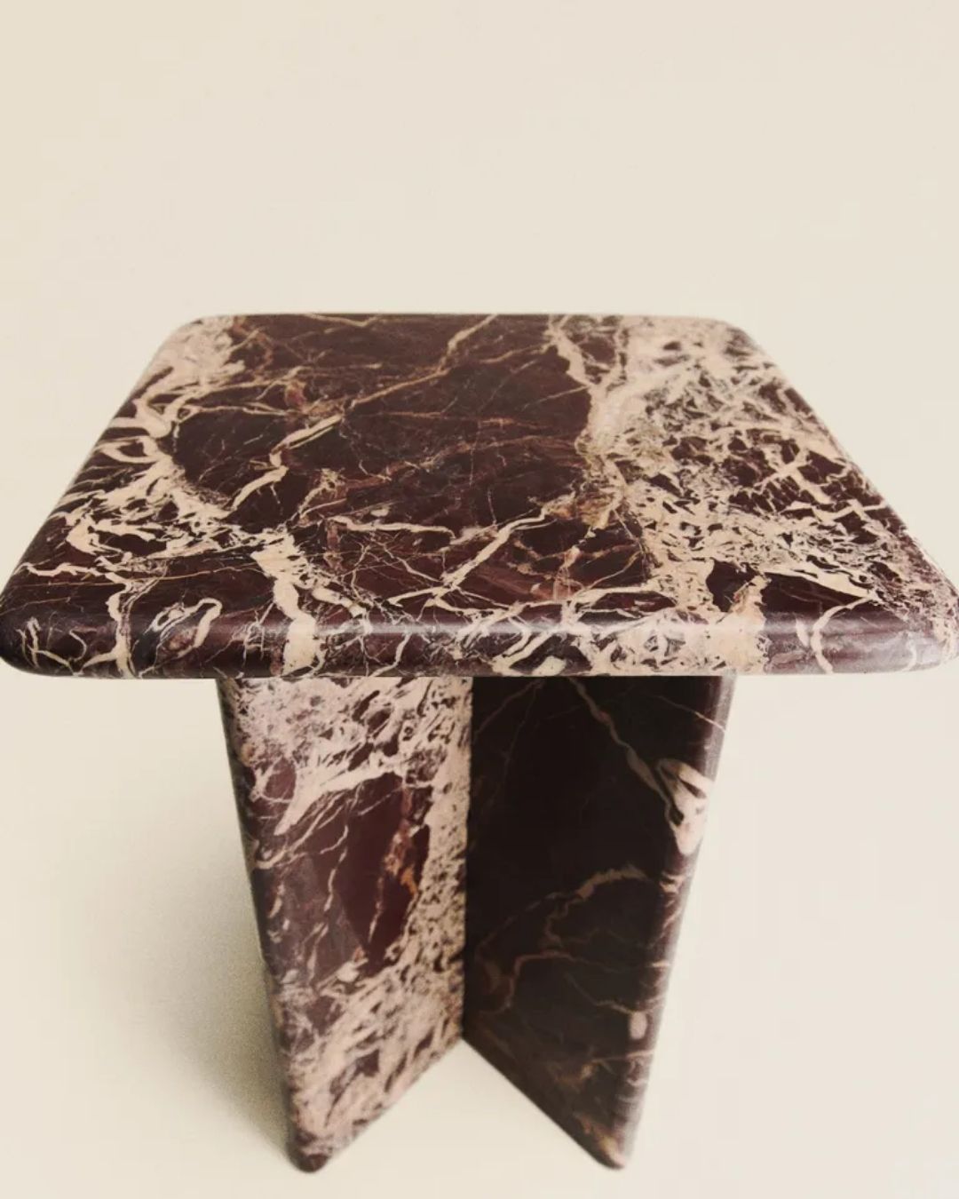 Marble Side Table against pale beige background.
