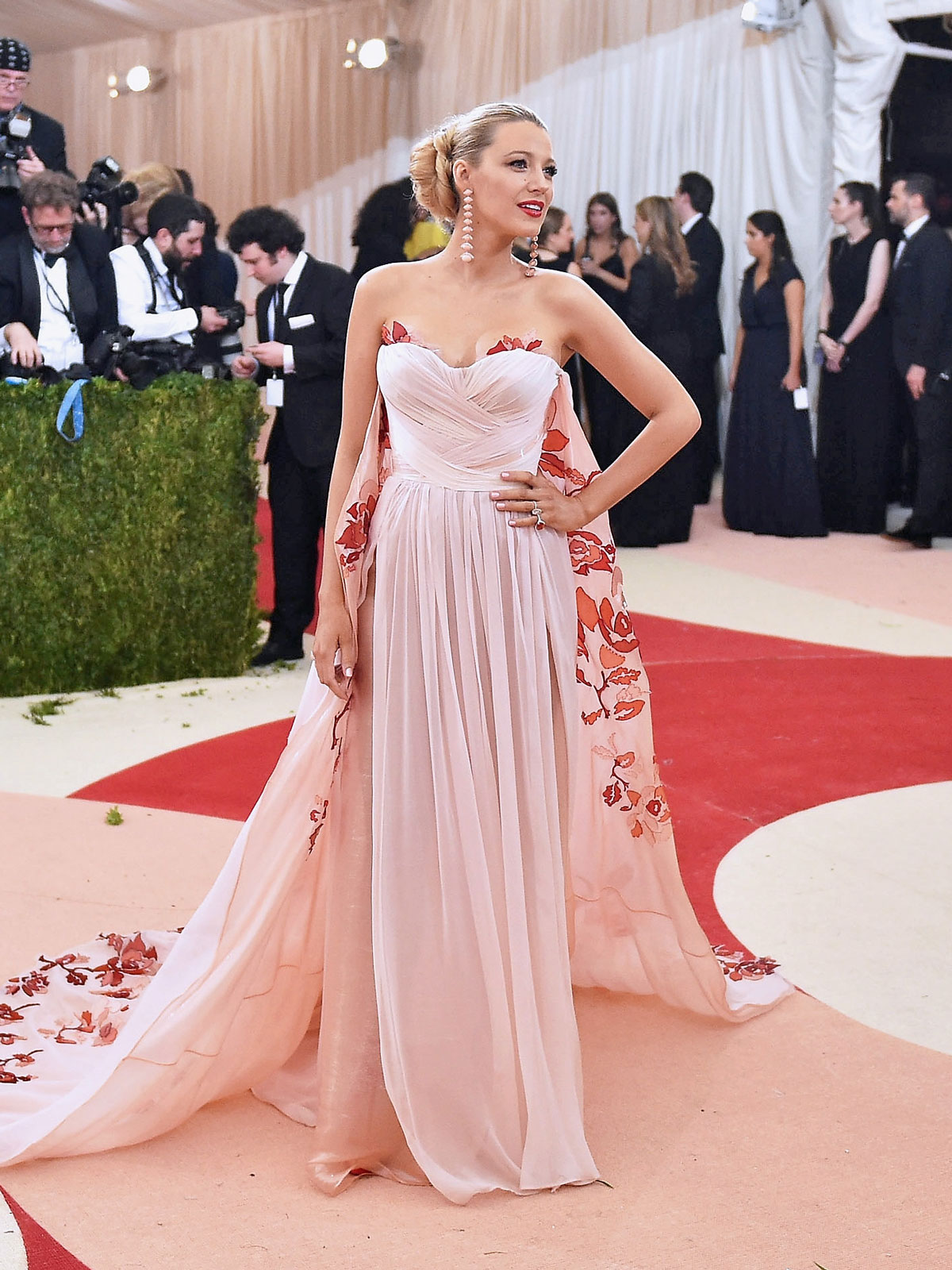 Blake Lively wears a strapless pink gown with a train