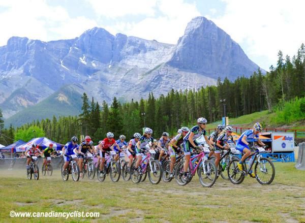 The women start beneath the Three Sisters mountains in Kananaskis Country, Alberta