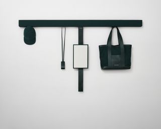 Black accessories by Kvadrat Raf Simons hanging on Shaker bar