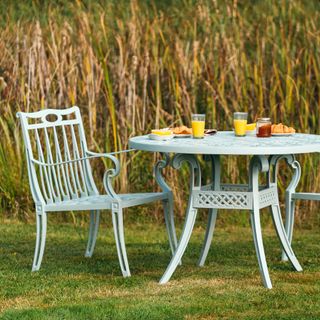 grass field with round table and chairs