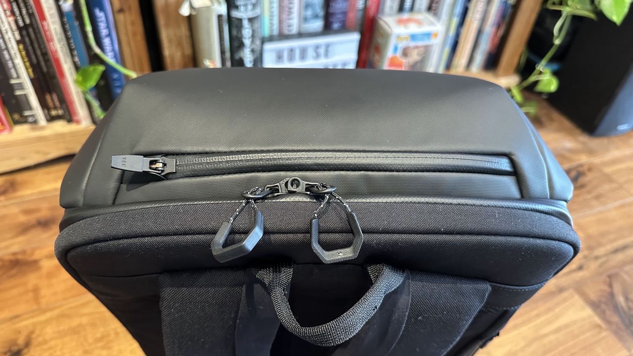 Mous Extreme Commuter backpack on a wooden floor in a living room