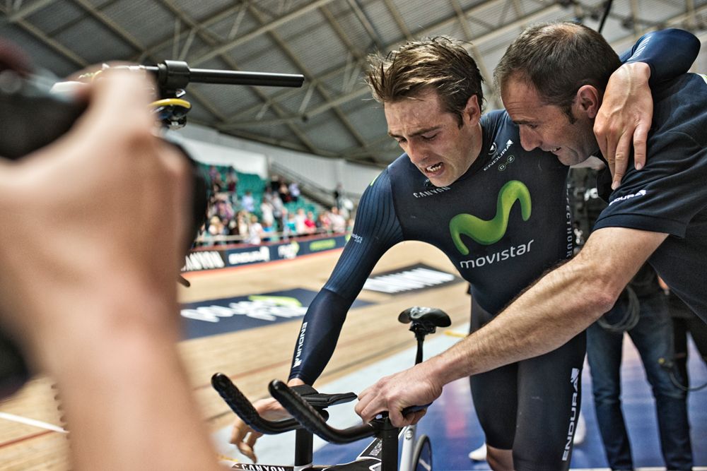 Dowsett is helped from his bike after the perfect hour
