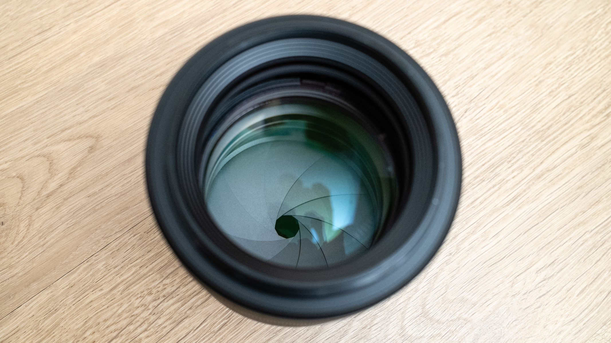 Canon RF 85mm f/1.2L USM on a wood floor