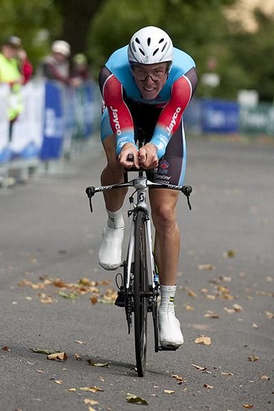Rohan Dennis checks the clock as he nears the finish line in his gold medal ride.