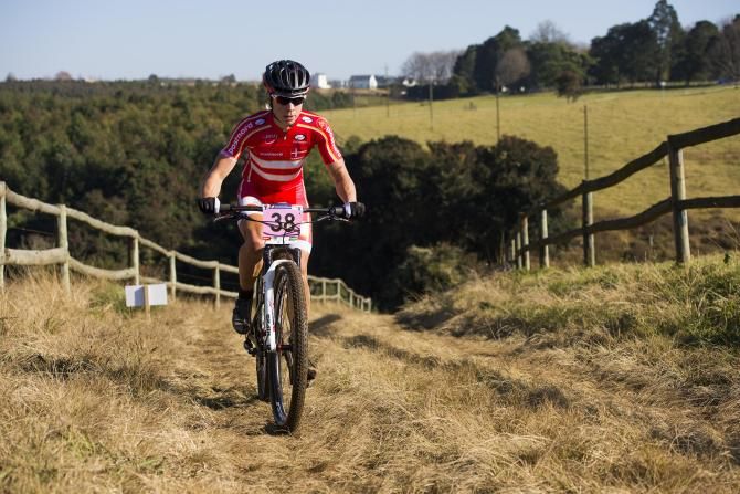 Annika Langvad of Denmark made a decisive early move in the women's race of the UCI MTB Marathon World Championships on Sunday as she cruised to her third world title of her career.