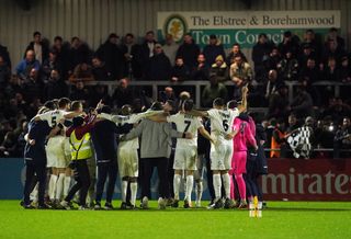 Boreham Wood players celebrate at full-time following the FA Cup third round win over AFC Wimbledon.