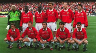 The Manchester United team line up for a photo ahead of the 1999 UEFA Champions League final at the Camp Nou in Barcelona, Spain.