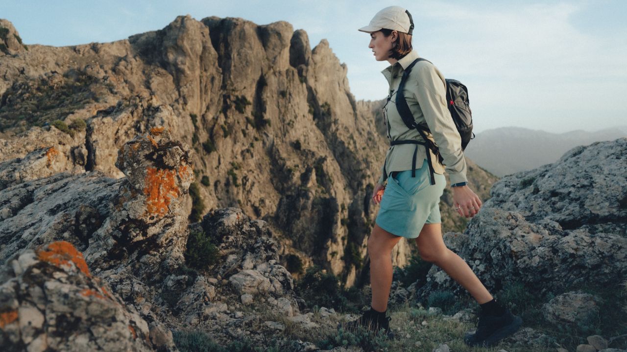 Young woman walking in the mountains