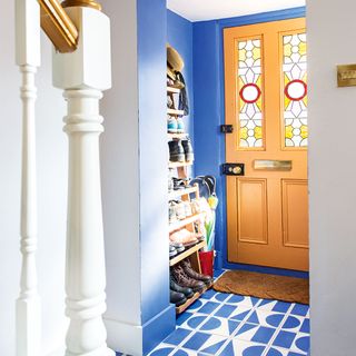 blue hallway with orange door