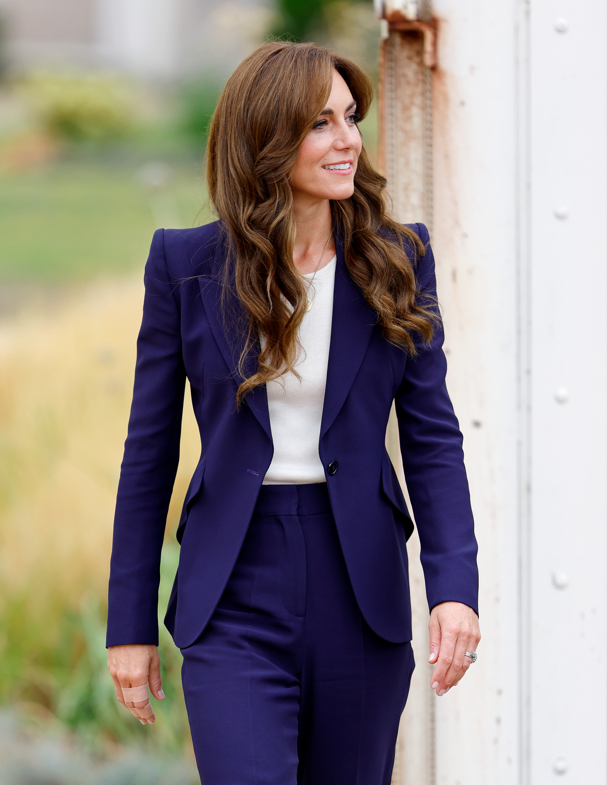 Kate Middleton in a deep blue pantsuit