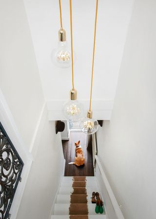 pendant lights dropped over a hallway
