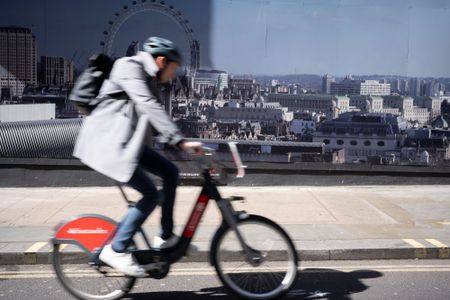 a man on an e-bike in London