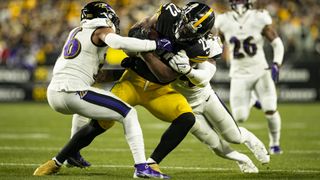 Pittsburgh Steelers running back Najee Harris (22) fights for extra yards during the game against the Baltimore Ravens and the Pittsburgh Steelers