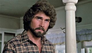The Amityville Horror James Brolin looking a little concerned in a bedroom