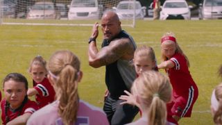 Dwayne Johnson chanting with a girls soccer team in Fate of the Furious