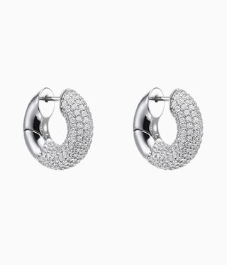 Silver hoop earrings half covered with diamonds