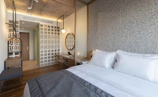 Shot of guestroom showing entrance to room & large bed