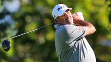Angel Cabrera looks on after hitting a drive
